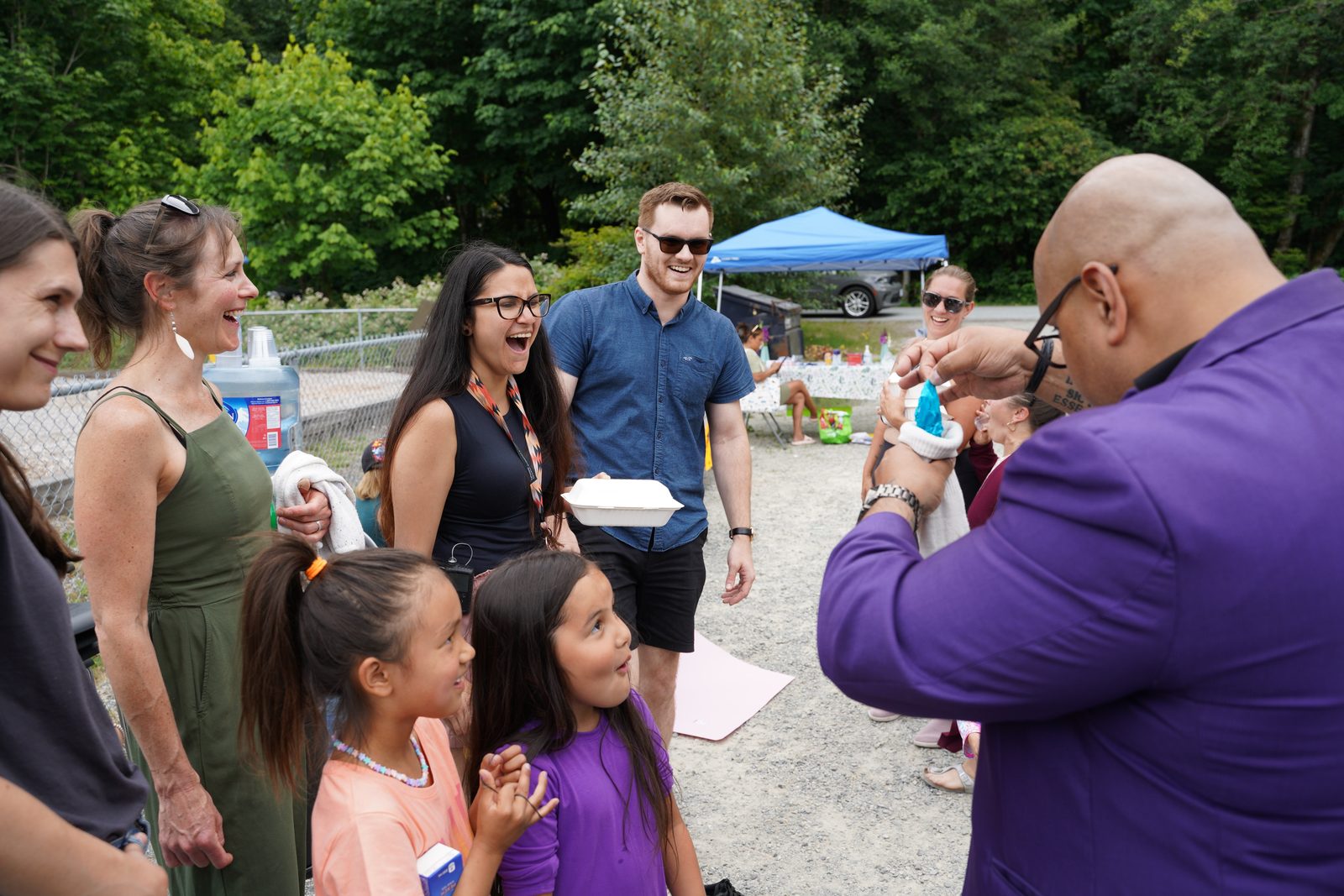 Children at a summer day camp watching a magic show in Metro Vancouver